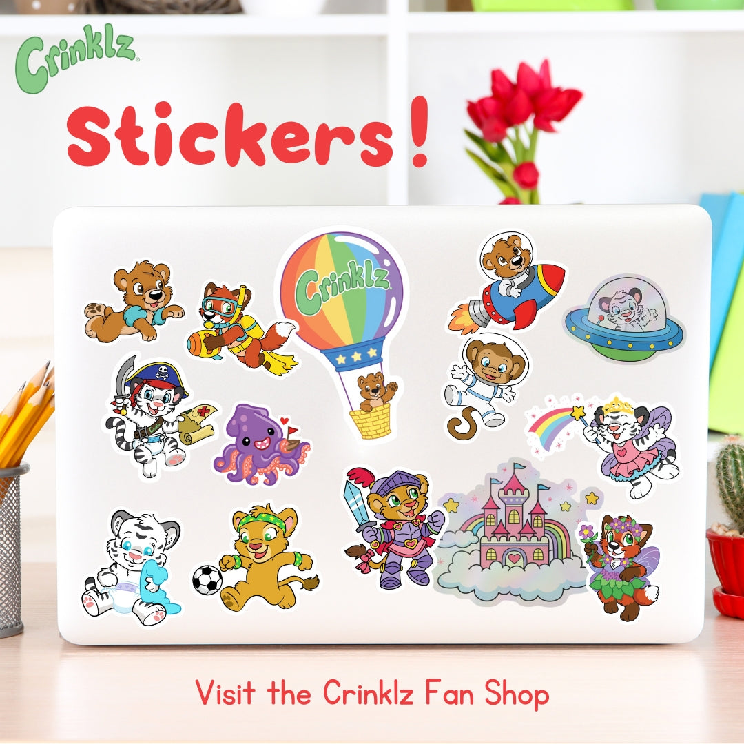 An image of a laptop with various stickers of Crinklz characters on it.